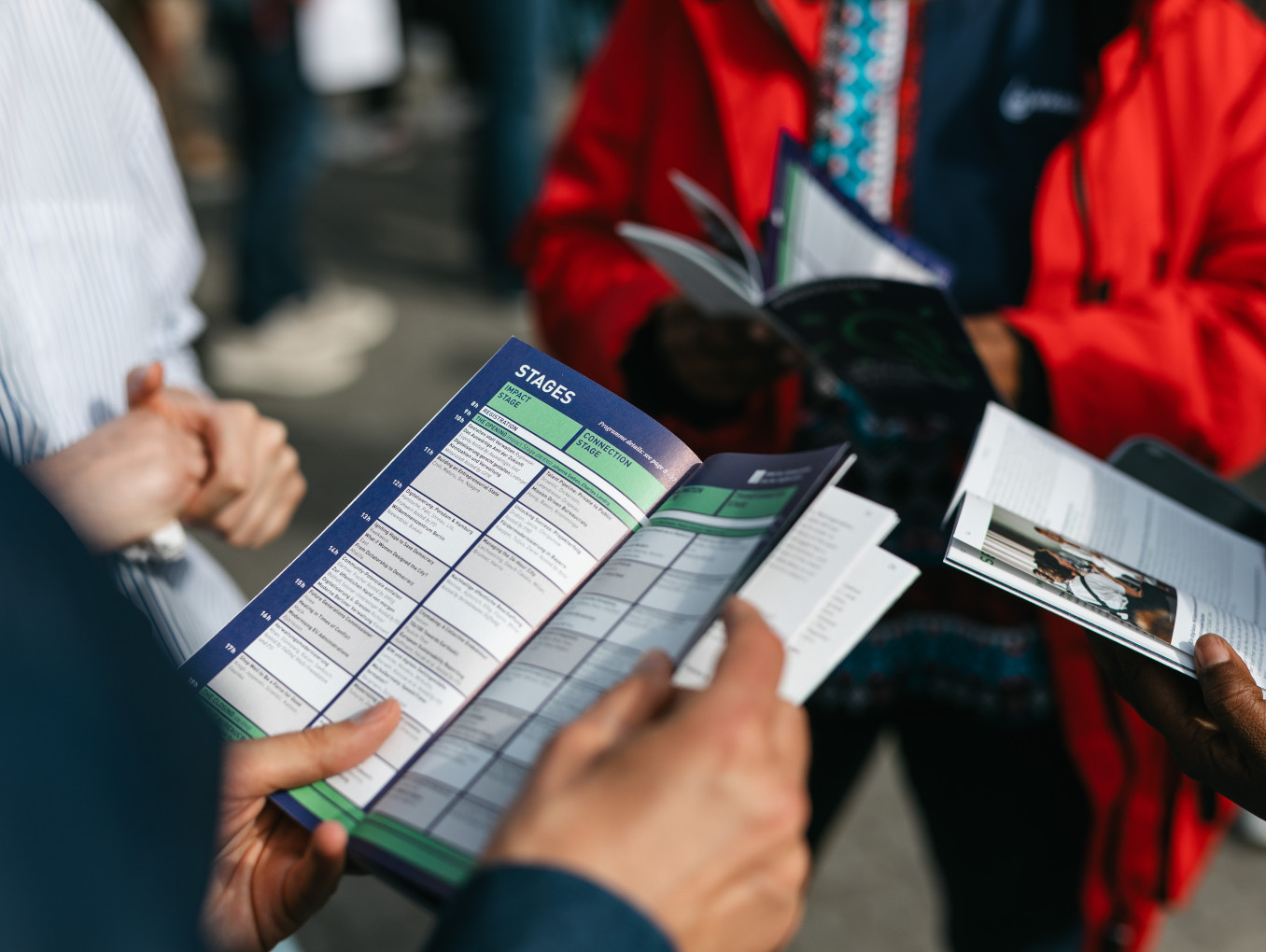 hands holding the festival Programm 