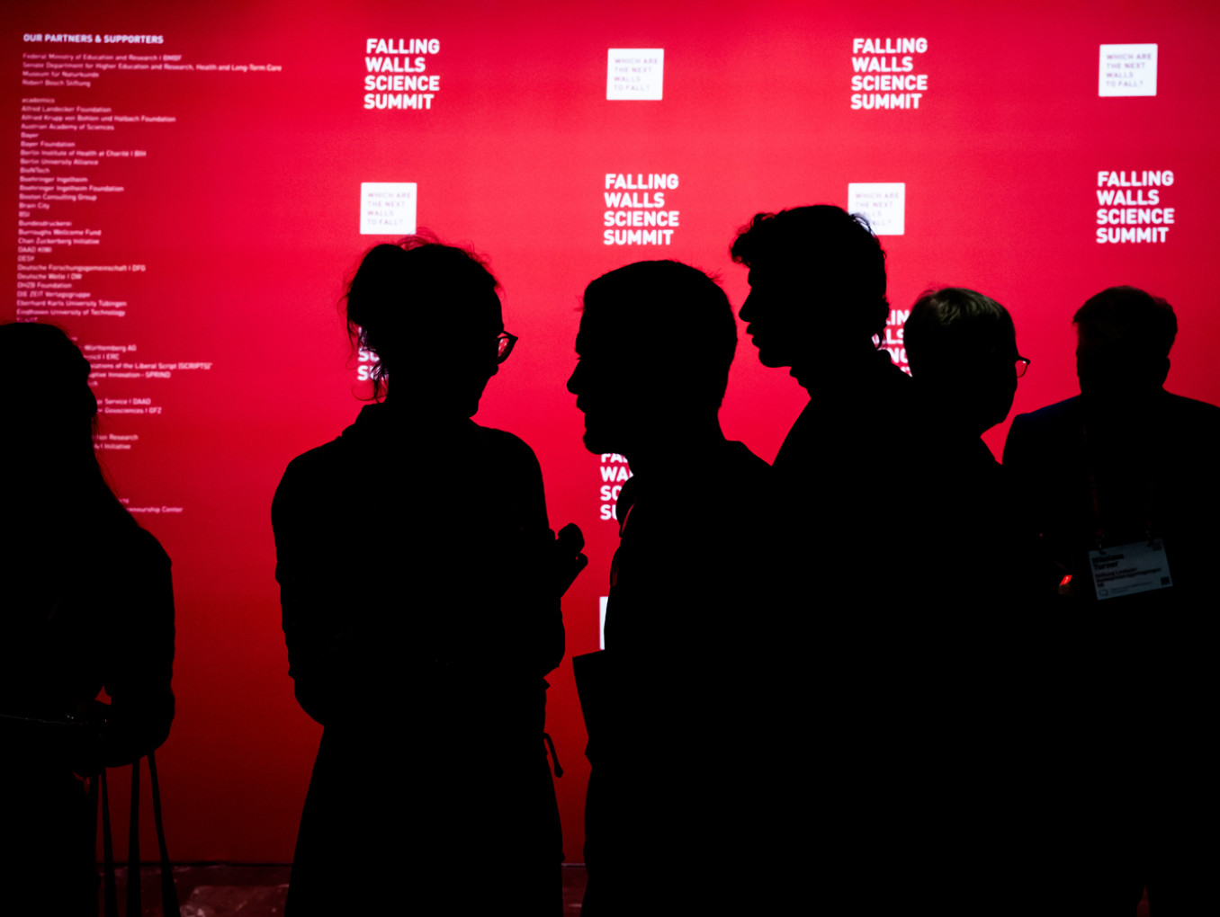People in front of the press wall at Falling Walls Science Summit