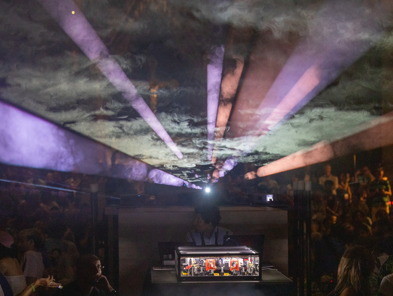 This photo, taken during the premiere of BruQner – The Sound of Entanglement, shows the Bell experiment, which produces entangled photon pairs and measures their quantum correlations. The light beams you can see here react to the experiment, as does the music. Copyright: Andreas Krenn, Land OÖ 