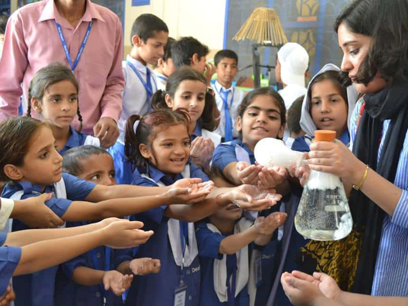 Lalah Rukh is showing the form from erlenmeyer flask to school children