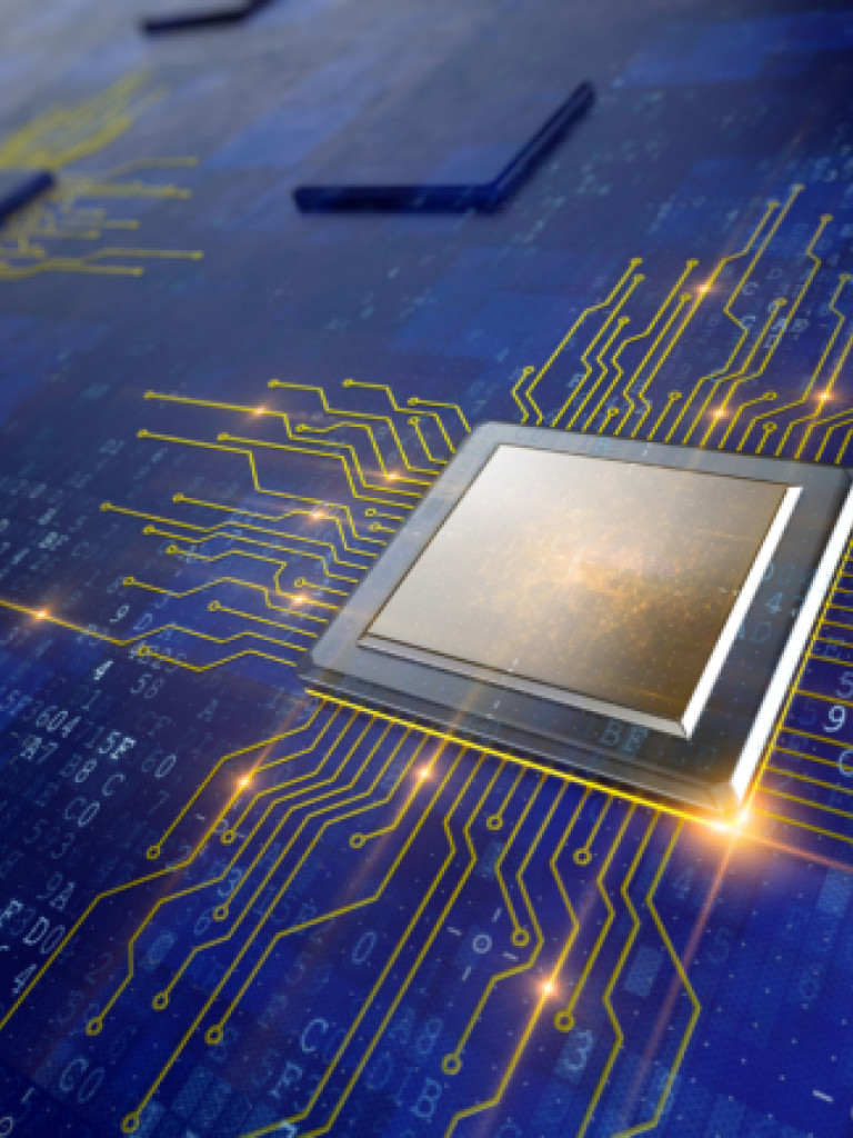A gold and silver computer chip on a blue board