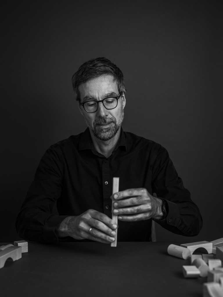 Image of Michael Platten with building blocks for Falling Walls' Shape the Future campaign