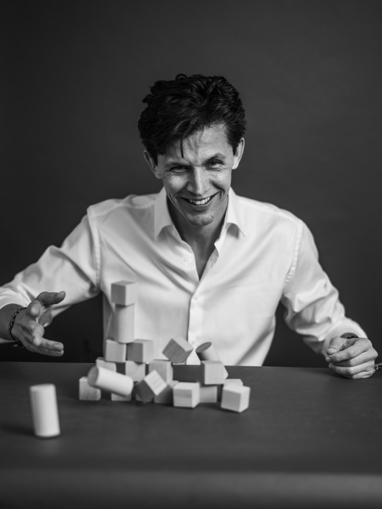 Image of Rafael Prieto-Curiel with building blocks for Falling Walls' Shape the Future campaign