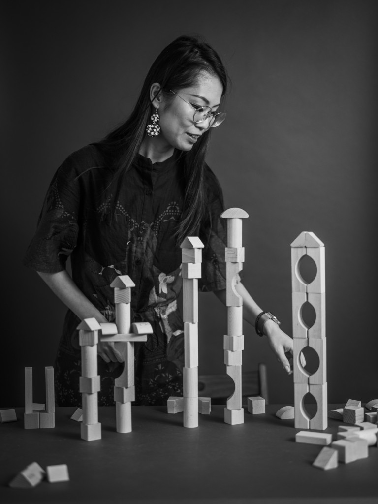 Image of Tiange Wang with building blocks for Falling Walls' Shape the Future campaign