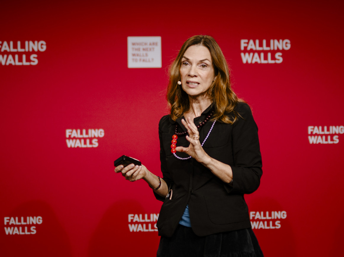 Magdalena Zernicka-Goetz breaking the wall of human embryo creation on stage at Falling Walls Science Summit 2024.