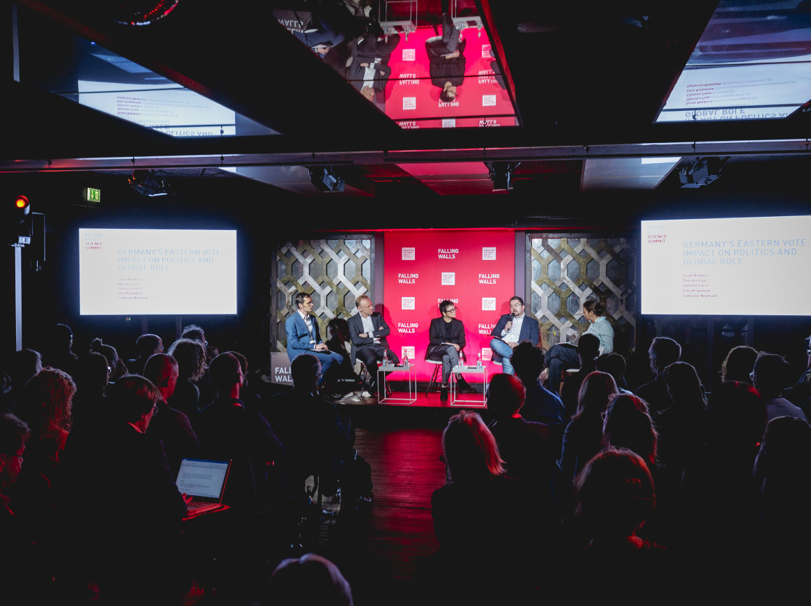 Speakers discussing and audience listening at falling Walls Science Summit 2024