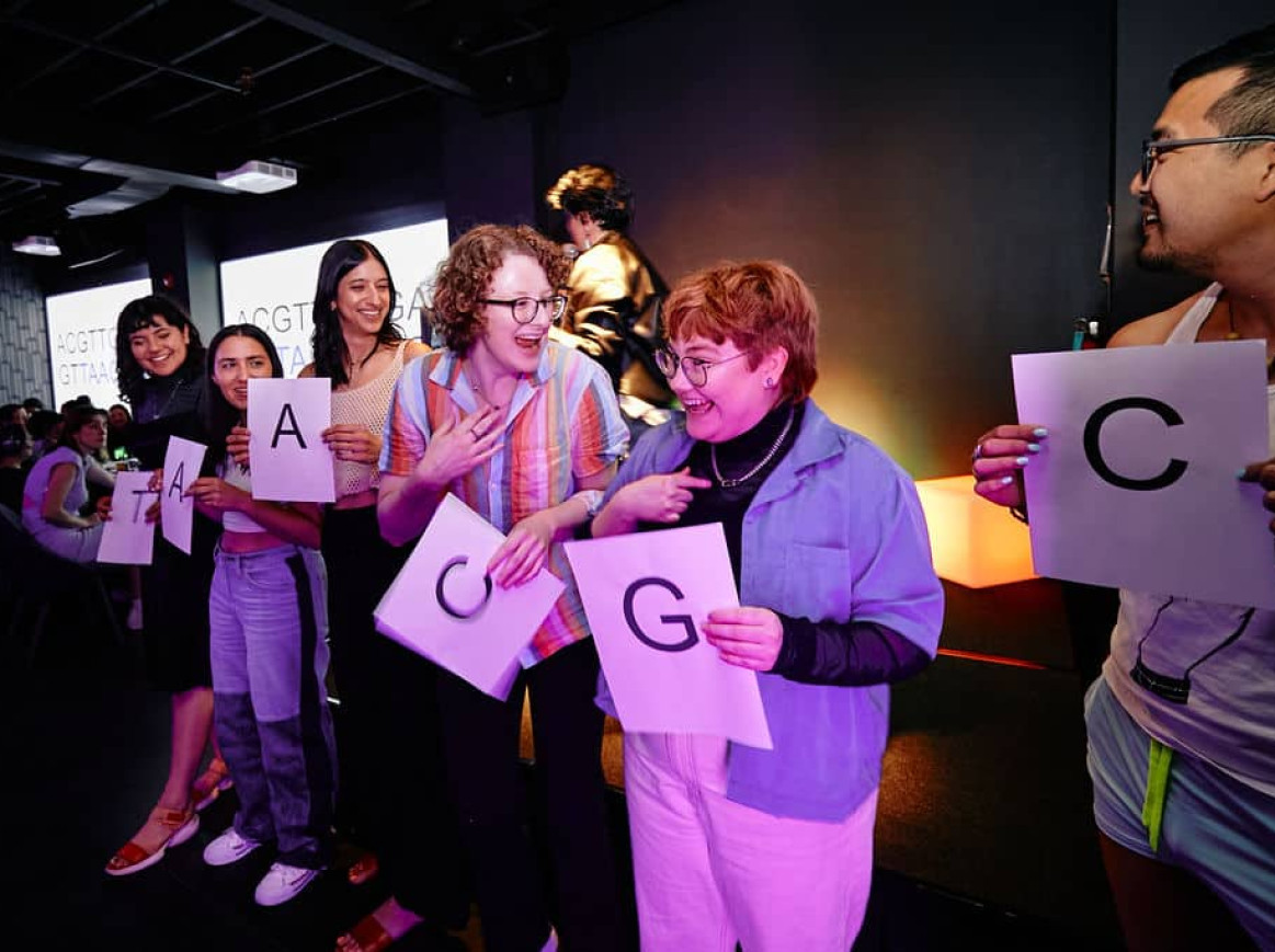 the audience participates in a gene sequencing demonstration to learn about genetic testing
