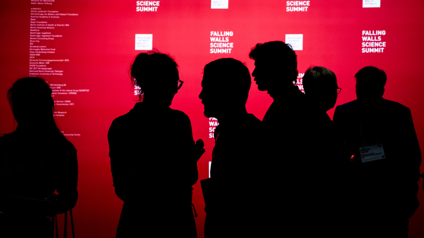 People in front of the press wall at Falling Walls Science Summit